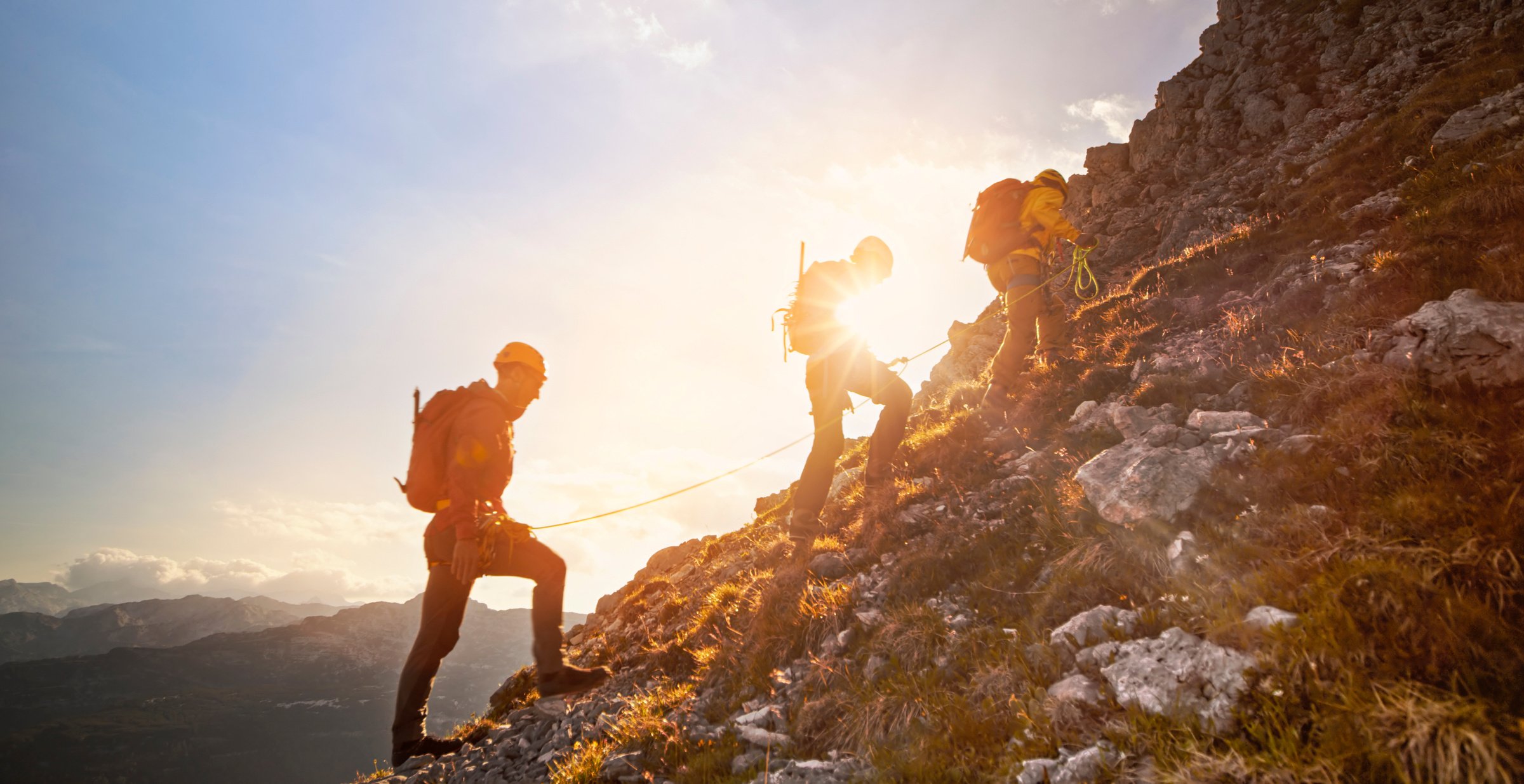 Mountaineers ascending mountain